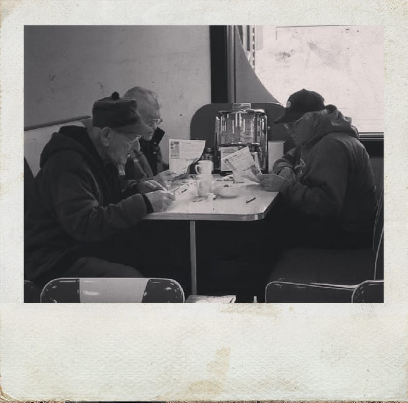 Poloroid of Senior Men Having Lunch at Jennies Diner